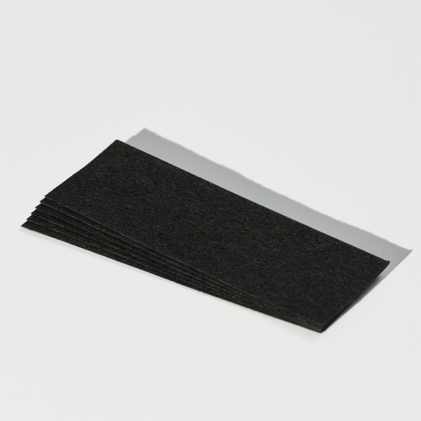 Brow Code's Pre-Cut Wax Strips on a white background with a shadow